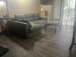a living room with a couch and a table at Dunavska Kuća in Smederevo