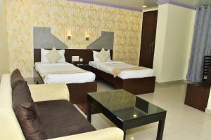 Postel nebo postele na pokoji v ubytování Hotel Chariot Inn Patna