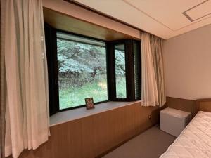 Letto o letti in una camera di 箱根七福荘