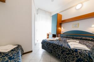 Postel nebo postele na pokoji v ubytování Hotel Golf