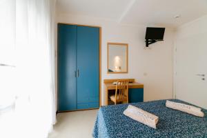 Postel nebo postele na pokoji v ubytování Hotel Golf