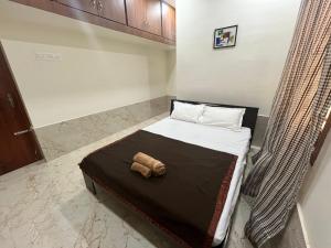 Postel nebo postele na pokoji v ubytování KBROS Homestay