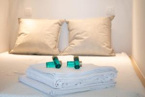 a toy train on a bed with pillows at Luxurious studio with a stunning view in Middelkerke