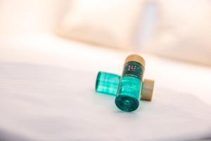 a green and brown tube of toothpaste next to a toothbrush at Luxurious studio with a stunning view in Middelkerke +15 photos