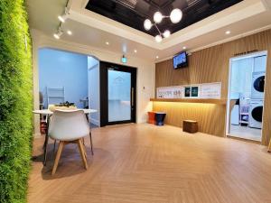 a room with a table and a chair in it at the stay Paju in Paju