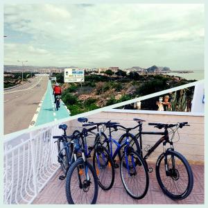a group of bikes parked on a balcony at Incluido clase de Yoga o Pilates in Calabardina +7 photos