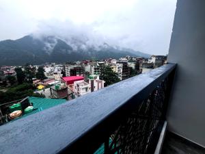 a balcony with a view of a mountain at The Tapovan Hills in Rishīkesh