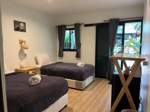 Postel nebo postele na pokoji v ubytování Namthip Homebeach