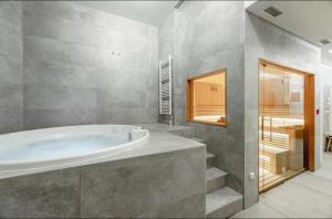 Koupelna v ubytování Aparthotel RAJSKA Jahorina + 52 fotografií