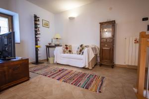 Postel nebo postele na pokoji v ubytování Santa Fiora Ospitalità Diffusa - La Vecchia Officina