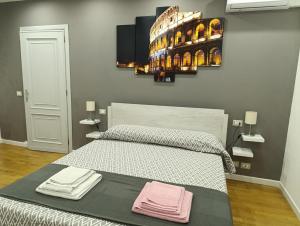 Postel nebo postele na pokoji v ubytování Oasi Del Vaticano