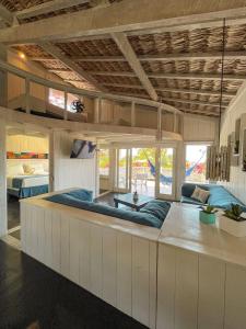 a large bed in a large room with a large bed at Nordestina Loft in Icaraí