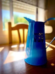 a blue vase sitting on top of a table at Villasultana 1 in Chipiona