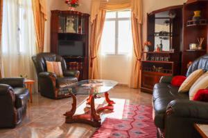 a living room with a couch and a coffee table at The View House in Ponta do Sol