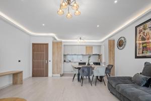 a living room with a couch and a table at ArtMob Apartment Isaran in Braşov