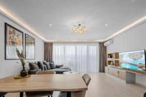 a living room with a table and a couch at ArtMob Apartment Isaran in Braşov