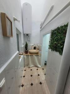 a white bathroom with a sink and a toilet at Maison avec piscine privée in Cabra del Santo Cristo +50 photos