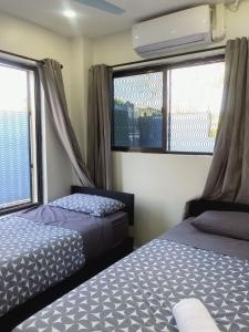 Ένα ή περισσότερα κρεβάτια σε δωμάτιο στο Holiday休闲公寓03