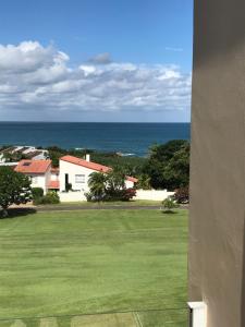 a view of the ocean from a house at 6th Tee Southbroom in Southbroom