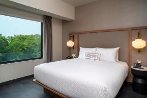 A bed or beds in a room at Fairfield by Marriott Lima Miraflores
