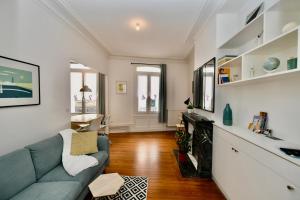 a living room with a couch and a fireplace at Le Havre De Paix in Le Perrey +18 photos