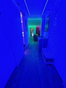 a hallway with blue lights in a room at Sensual Sierra VIP in Prado del Rey