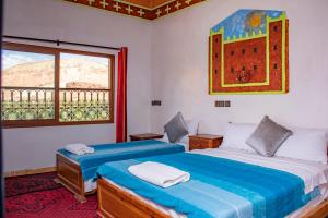 Postel nebo postele na pokoji v ubytování Hotel Awayou
