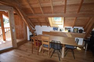 a dining room with a wooden table and chairs at Apartment 19 in La Salle-les-Alpes +16 photos