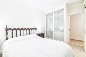 Katil atau katil-katil dalam bilik di Comfortable Apartment with Terrace