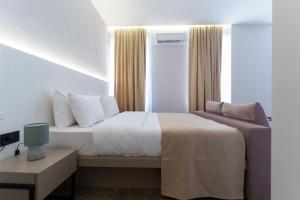 Postel nebo postele na pokoji v ubytování Move In Apartments