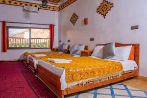 Postel nebo postele na pokoji v ubytování Hotel Awayou