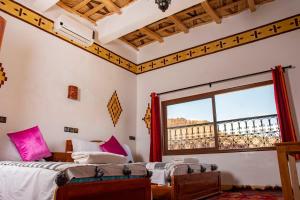 Postel nebo postele na pokoji v ubytování Hotel Awayou
