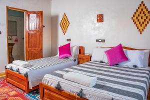 Postel nebo postele na pokoji v ubytování Hotel Awayou