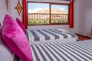 Postel nebo postele na pokoji v ubytování Hotel Awayou