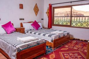 Postel nebo postele na pokoji v ubytování Hotel Awayou