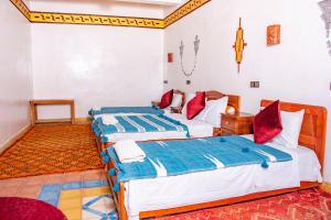 Postel nebo postele na pokoji v ubytování Hotel Awayou