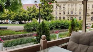 a balcony with a view of a building at Apartament Panoramiczna "Sloneczny Balkon z Widokiem na caly Szczecin" in Szczecin