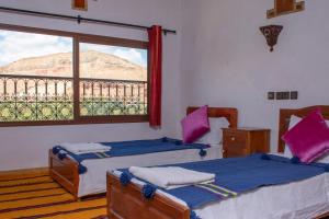 Postel nebo postele na pokoji v ubytování Hotel Awayou
