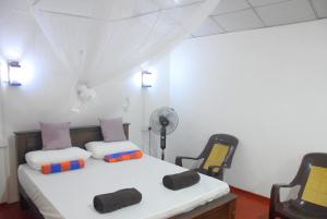 Postel nebo postele na pokoji v ubytování Nethu Herbal Villa