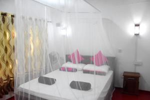 Postel nebo postele na pokoji v ubytování Nethu Herbal Villa