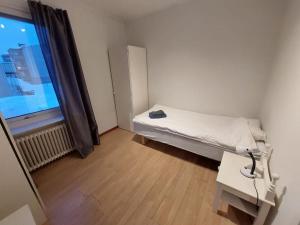 Postel nebo postele na pokoji v ubytování Spacious three-room apartment with balcony
