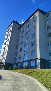 a large white building with a road in front of it at Alojamiento en Ushuaia - Mirador del Beagle in Ushuaia