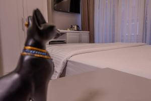 a statue of a dog standing in a bedroom at Classio Hotel Kadıköy in Istanbul
