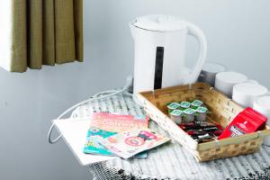 a basket on a table with a blender and other items at Elemental Surf Lodge in Newquay