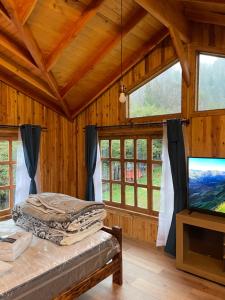 TV a/nebo společenská místnost v ubytování Cabañas bello horizonte