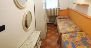 Postel nebo postele na pokoji v ubytování Appartamenti Falco