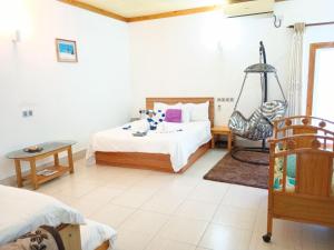 Letto o letti in una camera di Olhumathi View Inn