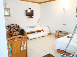 Area soggiorno di Olhumathi View Inn