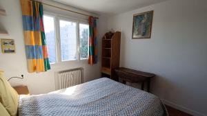 Posteľ alebo postele v izbe v ubytovaní Charmant 3 pièces 10 min de Lyon