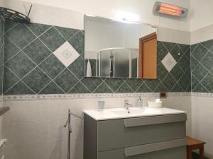 a bathroom with a sink and a mirror at B&B Luna - Osio Sopra in Osio Sotto +20 photos